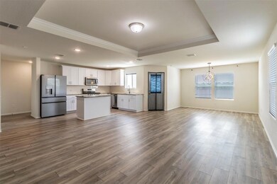 Kitchen featuring stainless steel appliances, a si