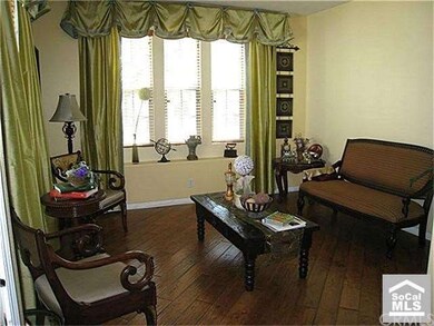 Formal living room with curtain.