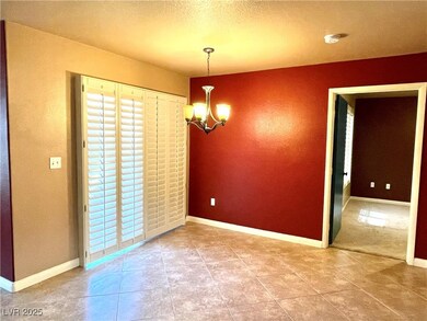 Dining area with tile flooring & patio access.