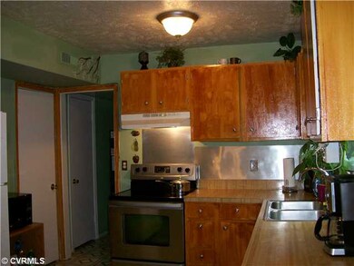 Kitchen - More kitchen.  Stove, refrigerator and d