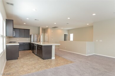 Kitchen with stainless steel appliances, light cou
