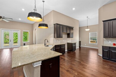 The large, open kitchen has enough cabinets and co