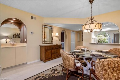 Dining space featuring a textured ceiling and ligh