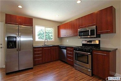 New stainless appliances in remodeled open kitchen