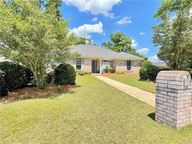 Single story home with a shingled roof, a front la