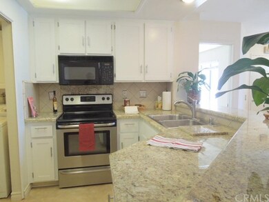 Remodeled kitchen with newer stainless stove, sink