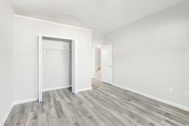 Unfurnished bedroom with light hardwood / wood-sty