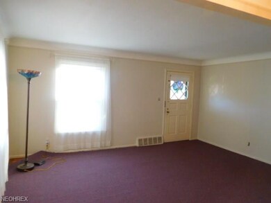 There is an oak floor under the carpeting as seen in the uncovered corner to the left.