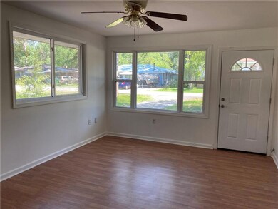 Spacious living room with lots of windows
