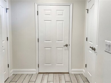 Enter here! Two deep storage closets.