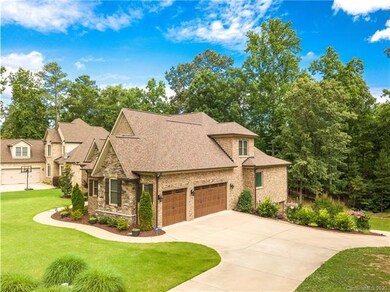 Beautifully landscaped double lot with 3 bay garag