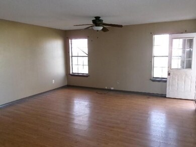 Spare room with baseboards, plenty of natural ligh