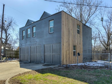 View of home's exterior featuring concrete driveway