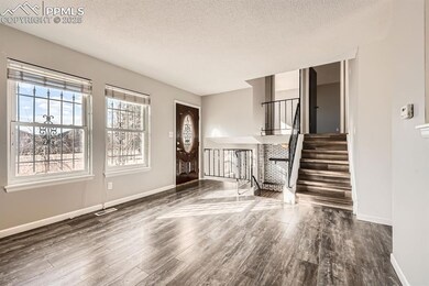 Unfurnished living room with visible vents, a text