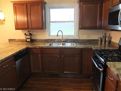 Remodeled kitchen with maple cabinets and new floo