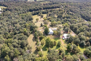 The House is the farm N of the Well House.  On the