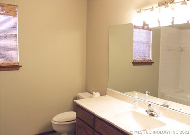 Hall bath with single sink and tub/shower combo.