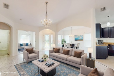Large living and dining areas virtually staged to