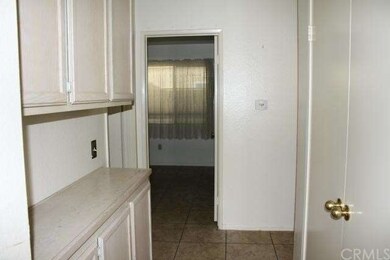Hallway to bedrooms, large closet on right, tile f