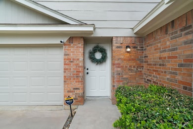 Entrance to property with brick siding