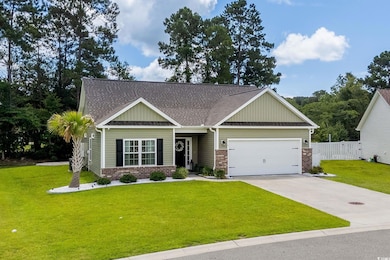Craftsman-style house with brick siding, a garage, concrete driveway, roof with shingles, and board and batten siding