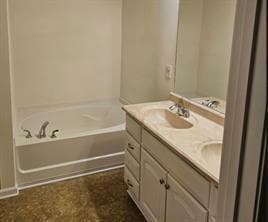 Full bath featuring a garden tub and double vanity