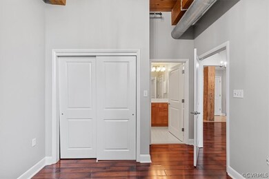 Unfurnished bedroom with dark tile floors, a close