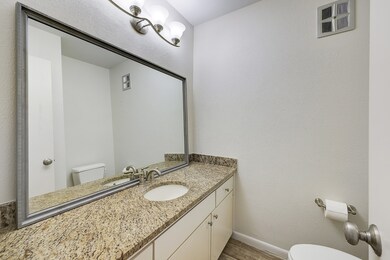 Spacious powder bathroom off of entry hallway