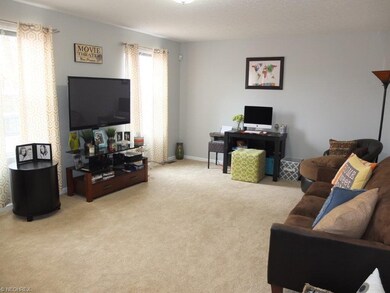 Living room open to the two story foyer.