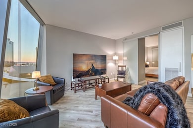 Living area with light wood-style flooring and bas