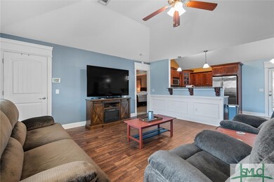 Open to dining room and kitchen.