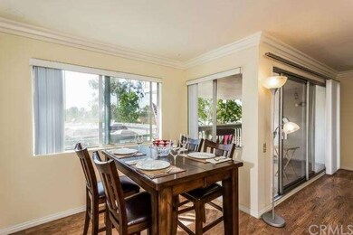 Dining room with wood floors & great sunset & hill
