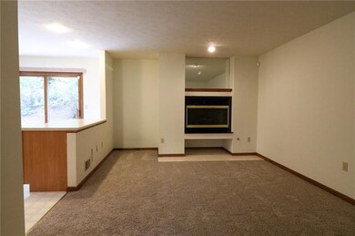 The Living Room with Gas Fireplace is Open to the 