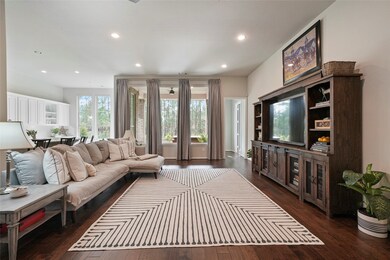 Filled with warm natural light and amazing views of the covered patio, huge fenced yard, and wooded greenbelt, this lovely family room is the perfect space to relax with your favorite people.