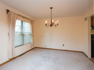 The spacious formal dining room features newer win
