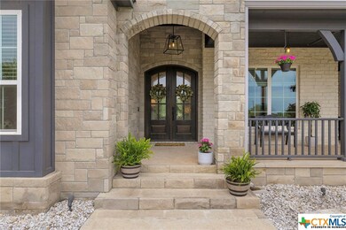 Elegant custom stone and board & batten exterior