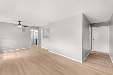 Unfurnished living room with a textured ceiling, 