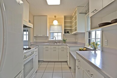 Kitchen with abundant cabinetry & tile flooring
