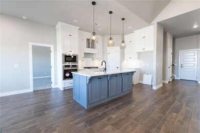 Room details featuring baseboards, wood finished f