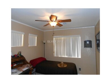 Property Photo. Secondary bedroom has ceiling fan