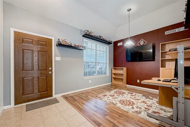 This room features a cozy office space tile floori