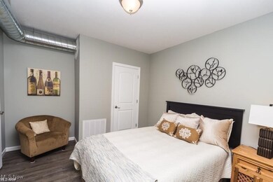 Bedroom featuring dark hardwood / wood-style flooring