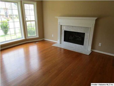 BEAUTIFUL HARDWOOD FLOORS IN FAMILY ROOM WITH FRES