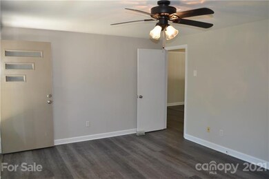 Enter the front door into the living room with lot