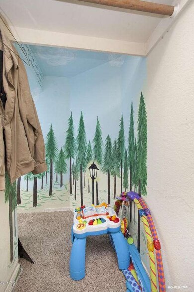 Narnia theme play closet under stairs