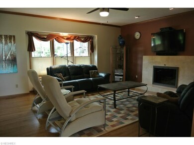 Gas fireplace has been enhanced with a modern marb