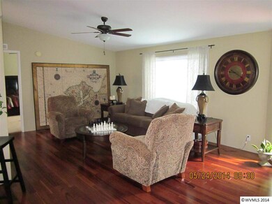 Room features include newer wood floors, vaulted c
