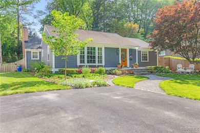 View of front of home with second chimney and beau