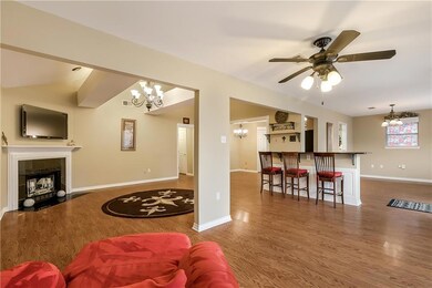 Living room view with vaulted ceilings and upgrade