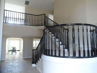 Upgraded travertene floors and updated banister 